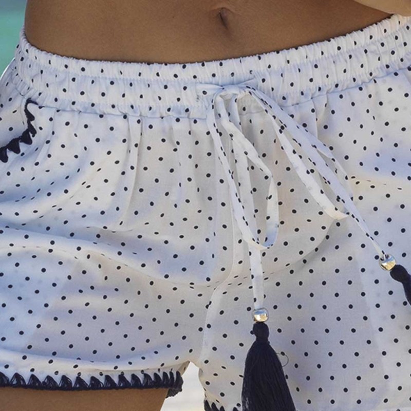 Pantaloncini copricostume bianchi pois